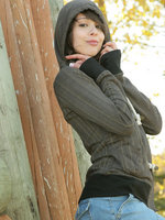 ariel rebel poses in the park