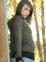 ariel rebel poses in the park