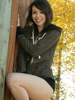 ariel rebel poses in the park