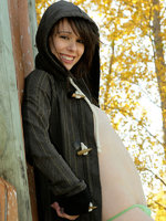 ariel rebel poses in the park