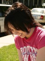 cute teen model poses in street