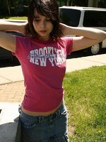 cute teen model poses in street