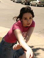 cute teen model poses in street
