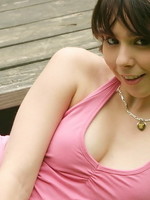 sexy teen sits at the park