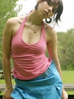 sexy teen sits at the park